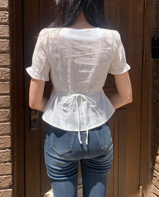 Back ribbon puff blouse