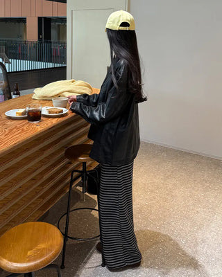Two-tone leather jacket with contrasting sleeves.
