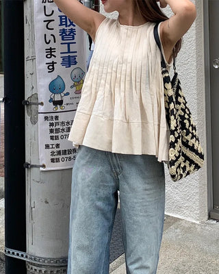 Pleated sleeveless blouse