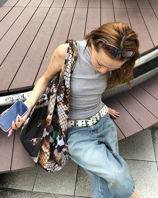 Double eyelet leather belt