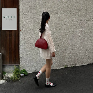 Half-round shoulder bag