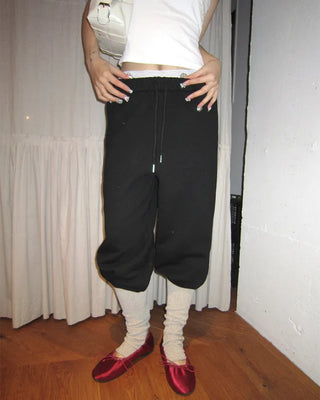 Open-heel ribbed knee-high socks layered pants
