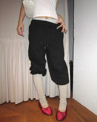 Open-heel ribbed knee-high socks layered pants
