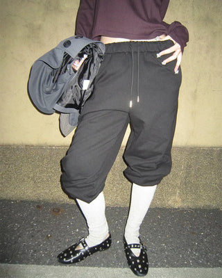 Open-heel ribbed knee-high socks layered pants