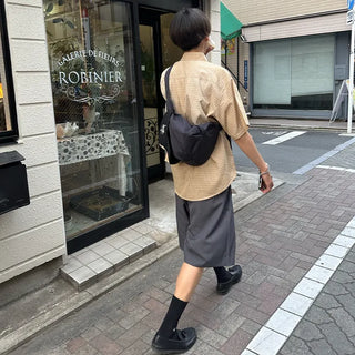 Pleated half-length slacks