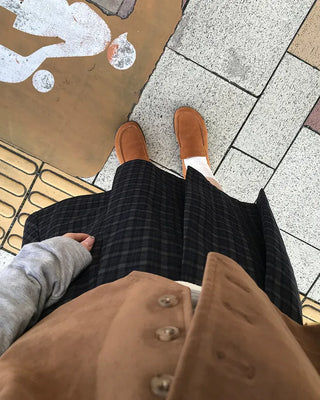 Checked pleated midi skirt