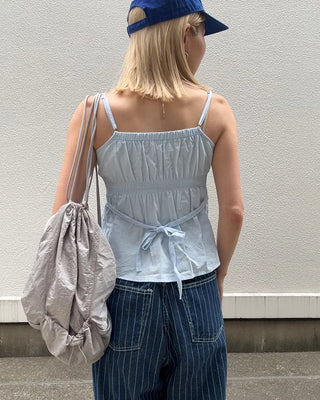 Half-button peplum camisole