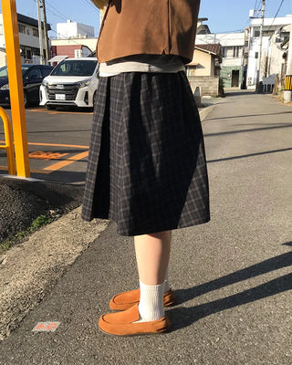 Checked pleated midi skirt