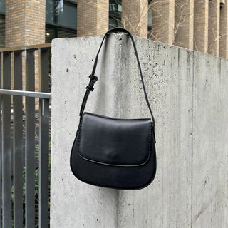 Round flap shoulder bag