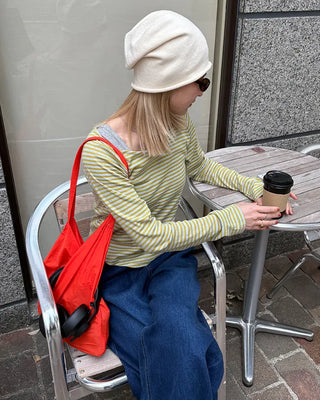 Boat neck striped perforated cut and sew