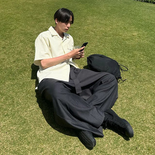 Wide-leg pants with belt and pleats