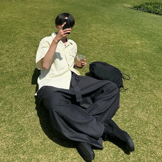 Wide-leg pants with belt and pleats