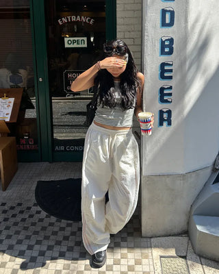 Wide-leg nylon jersey pants with hip pockets