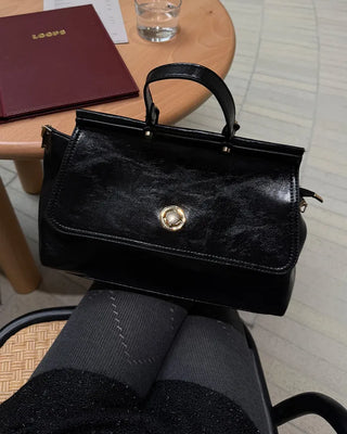 Gold button shoulder bag