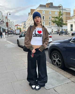 Coated black baggy denim pants
