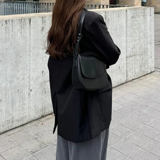 Round flap shoulder bag