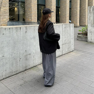Round flap shoulder bag