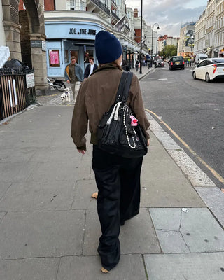 Coated black baggy denim pants