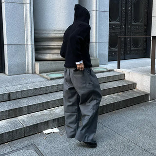 Wide-leg slacks with side pleats