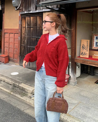 Cable knit high neck half-zip sweater