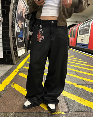 Coated black baggy denim pants