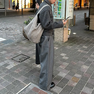 Wide-leg slacks with side pleats