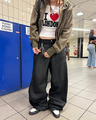 Coated black baggy denim pants