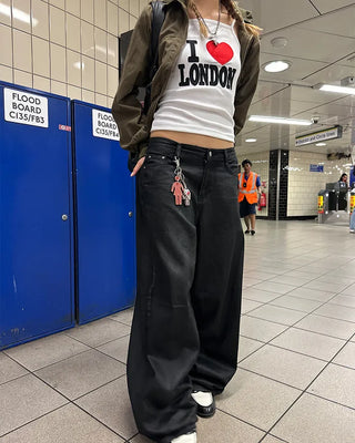 Coated black baggy denim pants