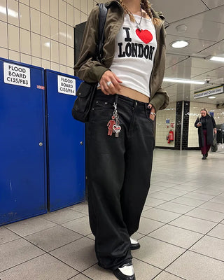 Coated black baggy denim pants