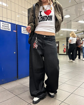 Coated black baggy denim pants