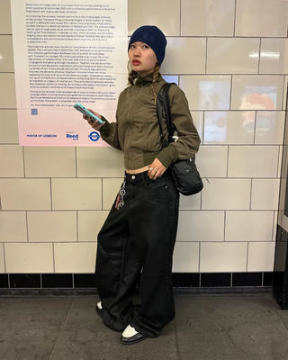 Coated black baggy denim pants