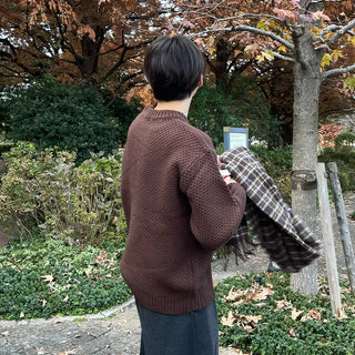 Round punched knit sweater