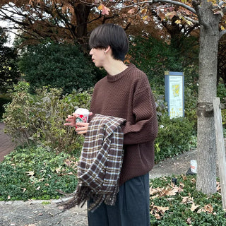 Round punched knit sweater