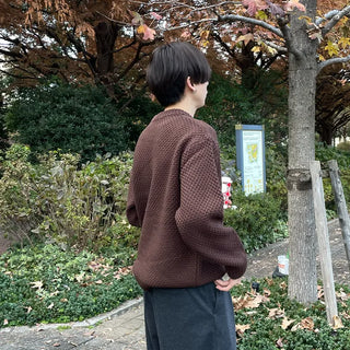 Round punched knit sweater