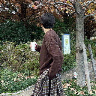 Round punched knit sweater