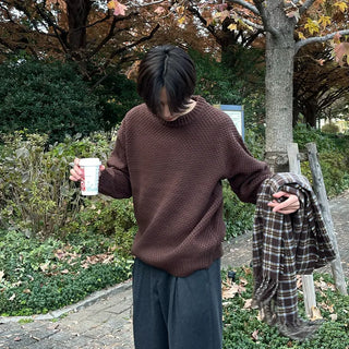Round punched knit sweater