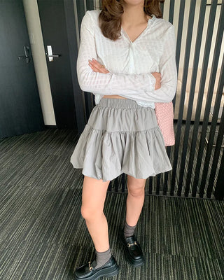 Belted voluminous mini skirt