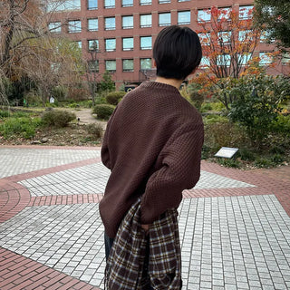 Round punched knit sweater