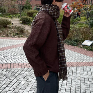 Round punched knit sweater