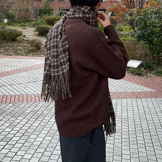Round punched knit sweater