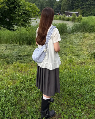 Striped half-moon shirred bag