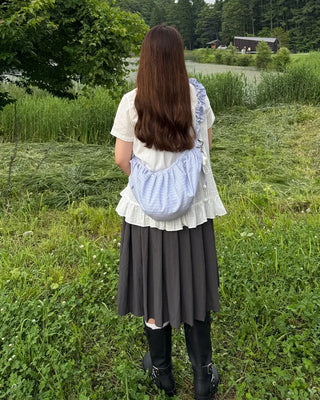 Striped half-moon shirred bag