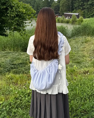 Striped half-moon shirred bag