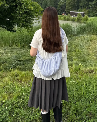 Striped half-moon shirred bag