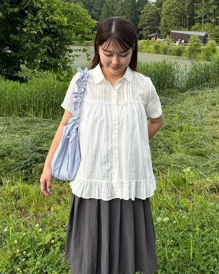 Striped half-moon shirred bag