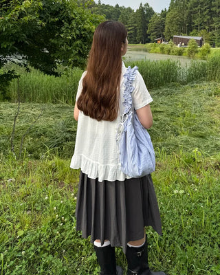 Striped half-moon shirred bag