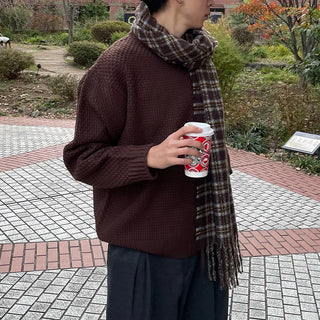 Round punched knit sweater