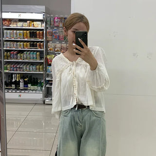 Punched open ribbon blouse
