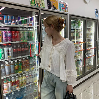 Punched open ribbon blouse