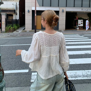 Punched open ribbon blouse